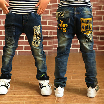 Loom & Soul Boys’ Denim Trousers – Letter Print Kids’ Jeans with Comfortable Fit and Durable FabricLoom & Soul Boys’ Denim Trousers – Letter Print Kids’ Jeans with Comfortable Fit and Durable Fabric